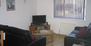 Beg - Lounge area with 2 x 3 seater settees, television (Satellite & DVD), HiFi with iPod Dock.