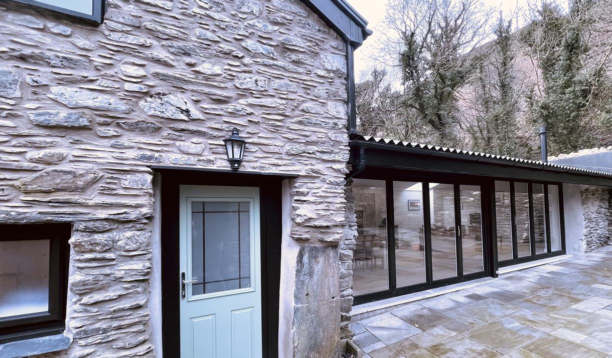 Entrance and bi fold doors to access outside courtyard.