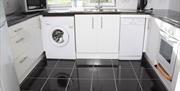 Beg Kitchen area - contains Fridge / Freezer, Washing Machine, Dishwasher, Cooker, Microwave, Kettle etc..