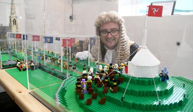 Speaker of the House of Keys inspecting the custom-built Lego model of Tynwald Day