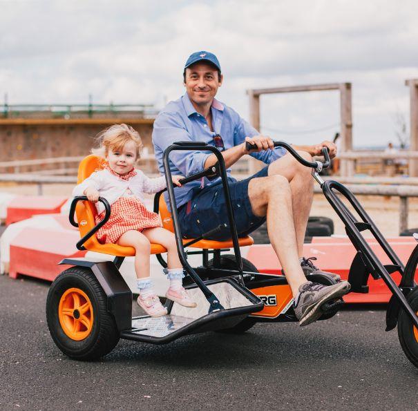 Father and daughter on the go-karts at Tapnell Farm Park, Isle of Wight