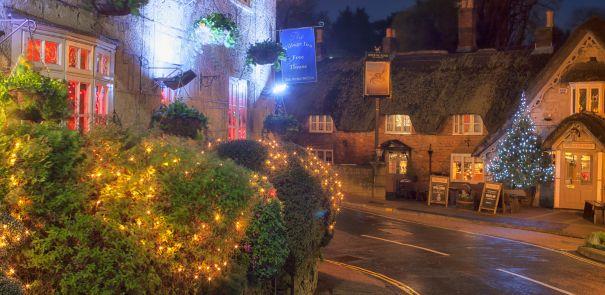 Night-time along Shanklin Old Village with Christmas tree and lights on display