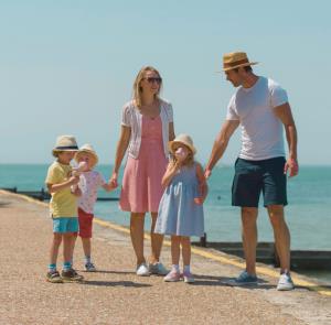 Family enjoying a walk at Colwell Bay beach on the Isle of Wight
