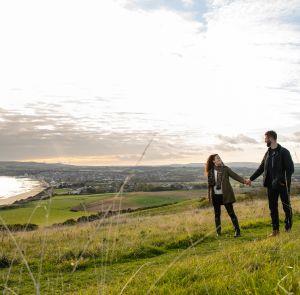 Couple walking along Culver down on the Isle of Wight