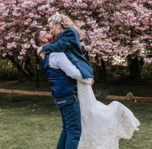 Groom picking up the bride and kissing, weddings on the Isle of Wight