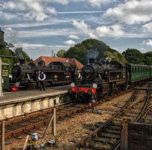 Steam trains stationed on the tracks at the Isle of Wight Steam Railway