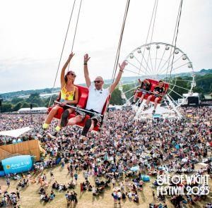 Couple on a ride at the Isle of Wight Festival