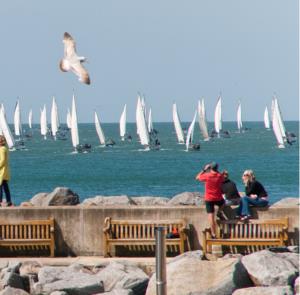 People watching the yachts during Round the Island Race on the Isle of Wight