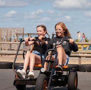 Two girls on the go karts at Tapnell Farm Park on the Isle of Wight