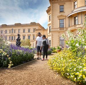 Couple walking around the grounds outside of Osborne house on the Isle of Wight