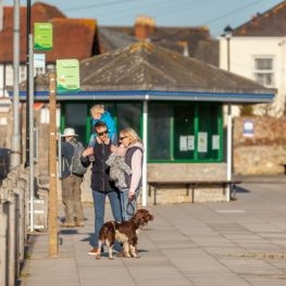 Family at the bus stop in Yarmouth on the Isle of Wight