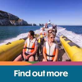 Group of people on a rib around the Needles on the Isle of Wight