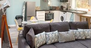 Open plan living area and kitchen at self catering cottage at The Wighthill, Sandown