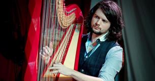 Benjamin Creighton Griffiths playing the harp, live music at Michelangelo Restaurant, Italian food