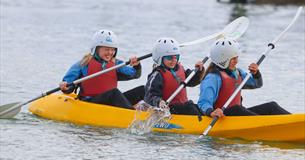 Children rowing in a canoe at UKSA, Easter fun day events, watersports, children activities, what's on, Cowes, Isle of Wight