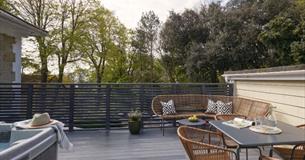 Hot tub, outside dining table and chairs on balcony at Eversley Apartment, Shanklin Villa, apartments, Isle of Wight, Self catering
