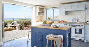 Kitchen at Flackstead with doors leading out to the patio with sea views, Wight Locations property, Isle of Wight, self catering, cottages and houses,