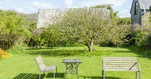 Outside garden area with benches at Gotten Manor Estate, Self catering, Isle of Wight