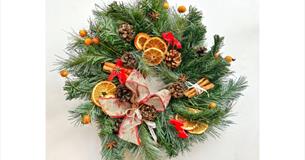 Family showing the crafts they've made at a craft workshop at Island CraftWorks, Ryde, Isle of Wight, family, Christmas Wreath, workshops