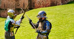 Two armoured knights fighting at Knights' Tournament at Carisbrooke Castle, history event, what's on, Isle of Wight