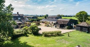 Aerial view of Middle Barn Farm with rolling countryside, self-catering, Isle of Wight