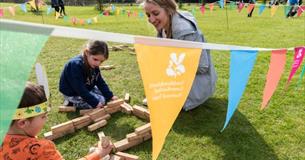 Family at a National Trust Easter event, what's on, children's activities - image credit: Paul Harris