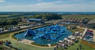 Aerial view of Isle of Wight Aqua Park at Tapnell Farm, outdoor watersports, activities, Isle of Wight