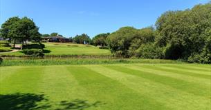 Course and clubhouse at Sandown & Shanklin Golf Club, Isle of Wight, activity