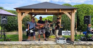The Spammy Oatis performing in the garden at Luccombe Hall Hotel, Shanklin, Isle of Wight, live music, performance
