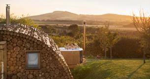 Outside view of Modulog with hot tub at Tapnell Farm, Isle of Wight, glamping, self catering - image credit: Skarsgard