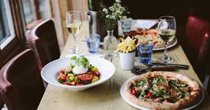 Pizza, salad, fries and wine at The Coast Bar & Dining Room, Cowes, Eat & Drink - Copyright: Maria Bell