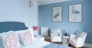 Isle of Wight, Accommodation, The Osborne Guesthouse, Shanklin, Blue Double Room with pictures of Cranes (Birds) on wall above seating area