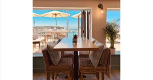 View of Yarmouth Harbour from inside and outside seating areas, The Terrace Yarmouth, restaurant