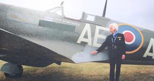Mary Ellis standing next to a Spitfire, Isle of Wight aviation history at Wight Aviation Museum, island life at Quarr Abbey, event, what's on