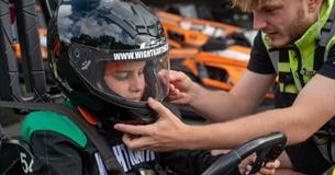 Man helping child with helmet before karting at Wight Karting, Ryde, Children's Events, junior track days