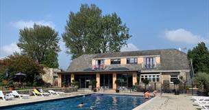 Apartments and The Core Complex overlooking the outdoor swimming pool at Appuldurcombe Gardens Holiday Park, Self catering, Isle of Wight