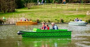 Family on a boat on the lake at Robin Hill Adventure Park, attraction, Isle of Wight, family fun, things to do
