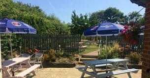 Outside view of garden with outside seating at The Fleming Arms, Binstead, local produce, let's buy local