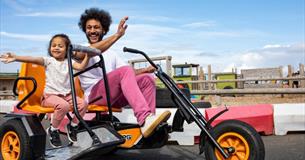 Father and daughter on the go karts at Tapnell Farm Park, Isle of Wight, attraction, family fun, activities