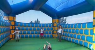 Children playing on a bouncy castle in the grounds of the Horse & Groom, eating out, local produce, Isle of Wight