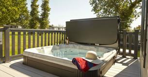 Hot tub on balcony of lodge at St Helens Holiday Resort, Isle of Wight, Self Catering