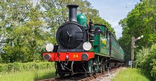 Steam train on tracks surrounded by countryside, Isle of Wight Steam Railway, Things to Do, Isle of Wight