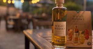 Bottle of Wight Whiskey on an outdoor dining table, New Inn, music event, Shalfleet, Isle of Wight, what's on