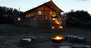 Outside view of safari tent at night, Glamping the Wight Way, self catering, Isle of Wight