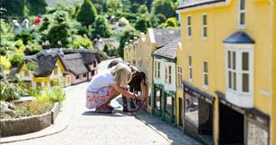 Child viewing the Old Shanklin Village miniature at the Godshill Model Village, Isle of Wight, Things to Do