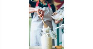 Lady putting sourdough in glass jar, workshops at the Garlic Farm, Isle of Wight, food event, what's on