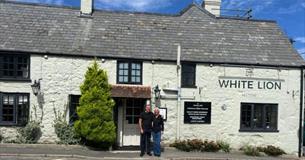 Managers of White Niton pub standing outside, Niton, Isle of Wight, eat & drink