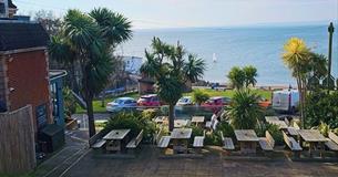 Sea view from outdoor eating area at The Woodvale, Gurnard, Isle of Wight, food and drink