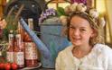 Girl with a garlic head band on standing next to local produce at the Isle of Wight Garlic Festival, what's on, event, Newchurch
