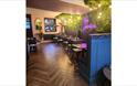 Isle of Wight, Eating Out, The Garden, Cowes, Inside seating with neon sign
